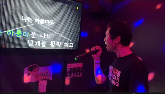 Singing karaoke at Bar.Kor.D